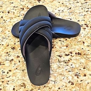Women's black OluKai slides